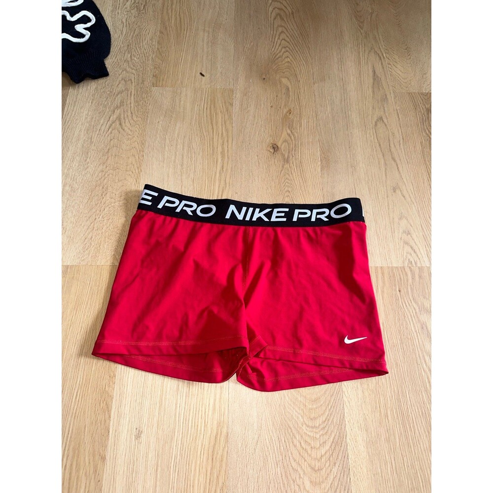 Nike Pro Women's Red Athletic Shorts with Black Waistband